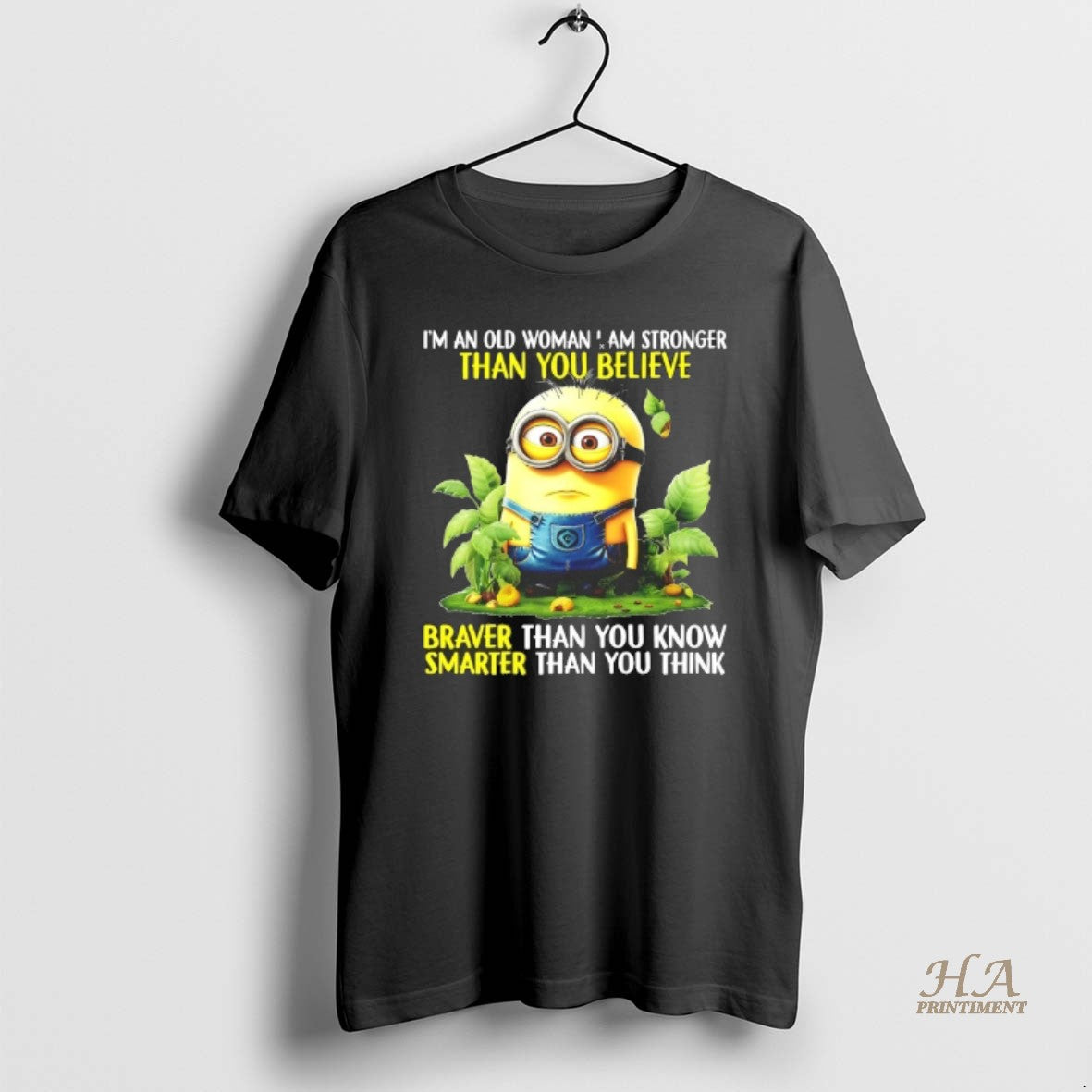 Official Minion Im An Old Woman I Am Stronger Than - Adult & Kids T-Shirts, Sweatshirts & Hoodies apparel design preview 1